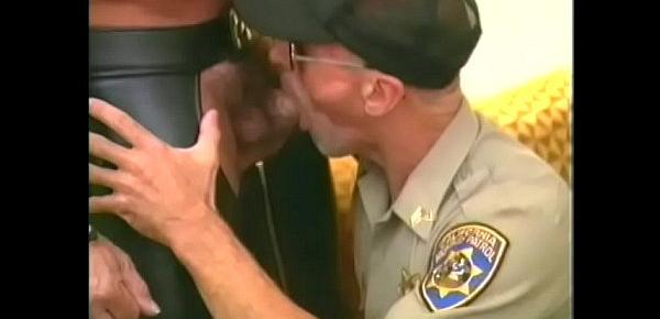  Muscular bear in leather chaps gets his cock slurped by police